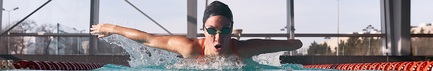 This is a banner photo image of a person swimming laps